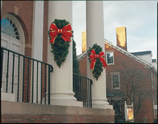 outdoor building columns decorated with designer garden swags for the holidays