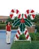 Daytime photo of giant outdoor garland and LED candy canes decoration