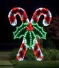 Nighttime photo of giant outdoor garland and LED candy canes decoration