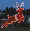 Animated Santa in Sleigh Garland Christmas Lights Commercial Outdoor Decoration - Night time photo