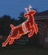 Animated Santa in Sleigh Garland Christmas Lights Commercial Outdoor Decoration - Night time photo